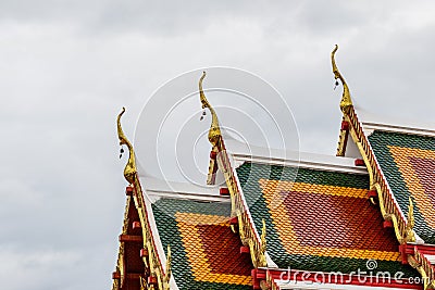 Thai art on roof Church at phathat Cheung choom woravihan temple Stock Photo
