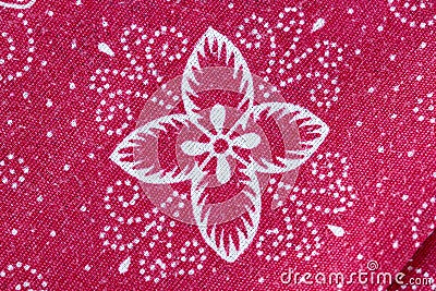 Thai Batik sarong of red flower pattern. Stock Photo