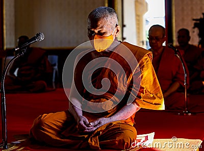 A Thai Buddhist monk wearing a facemask Editorial Stock Photo