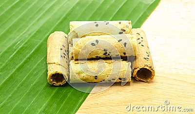 Thai coconut cracker roll on banana leaf. Stock Photo