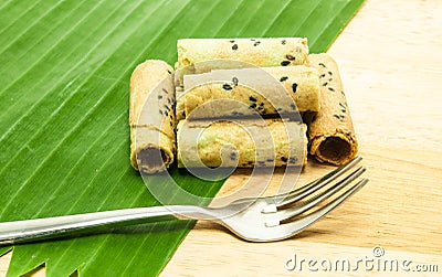 Thai coconut cracker roll on banana leaf. Stock Photo