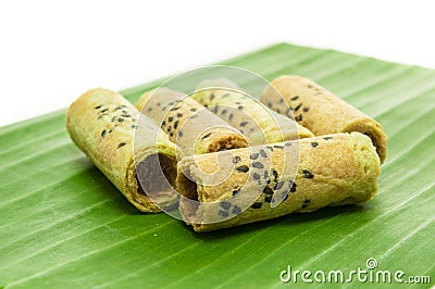 Thai coconut cracker roll on banana leaf. Stock Photo