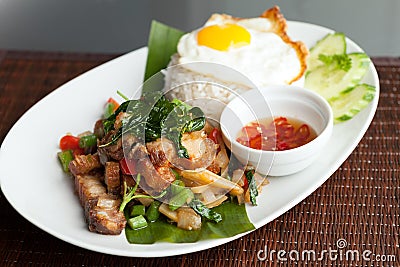 Thai Crispy Pork with Fried Egg Stock Photo