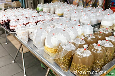 Variety of Thai dessert in plastic bag for sell at Sutthisan market, Bangkok, Thailand Stock Photo