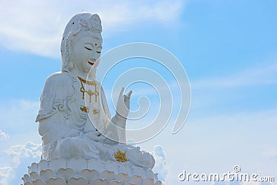 Thai famous big white bodhisattva guanyin statue with copy space sky background at Wat Huai Pla Kung temple, Chiang rai. Stock Photo