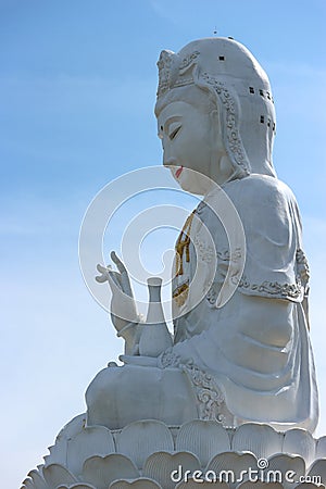 Thai famous big white bodhisattva guanyin statue with copy space sky background at Wat Huai Pla Kung temple, Chiang rai Stock Photo