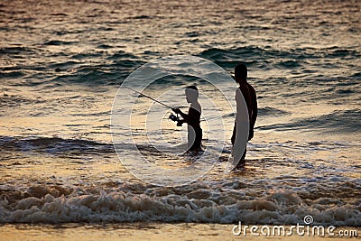 Thai fisher boy, with his father on fishing on sunset. Thailand Editorial Stock Photo