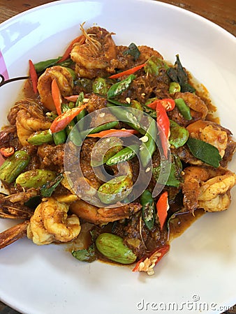 Thai food menu Stir fried shrimp curry with Sato. Stock Photo