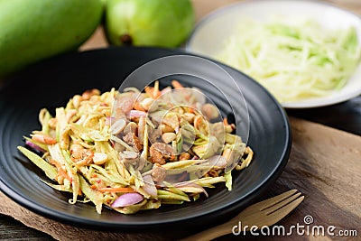 Thai food, Spicy green mango salad Stock Photo