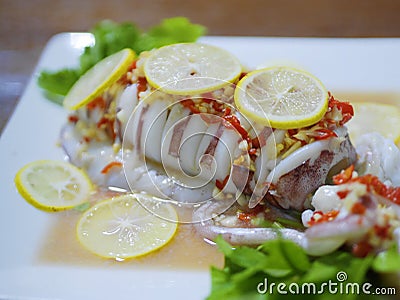 Thai food street - steam squid with spicy chili and lemon Sauce Stock Photo