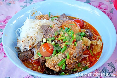 Thai food style, Rice noodles with spicy pork sauce in bowl Stock Photo