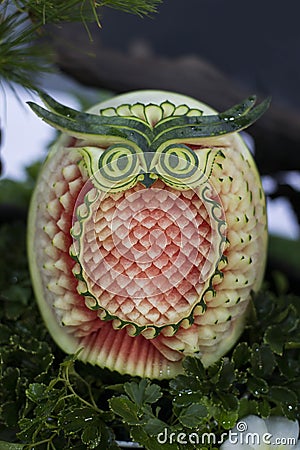 Thai fruit carving on watermelon in owl shape Stock Photo