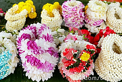 Thai garlands and amulets of flowers for religious ceremonies and offerings to spirits Stock Photo