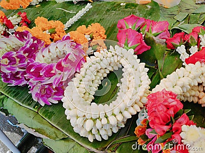 Thai garlands are on sale at a storefront in Bangkok, Thailand. Stock Photo