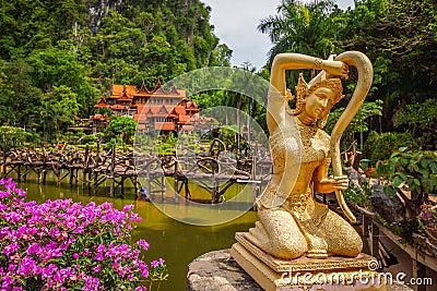 Thai literature golden Goddess of the earth statue Stock Photo