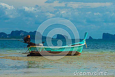 Blue Thai Longboat on the beach Stock Photo