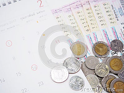 Thai lottery tickets and Thai calendars with red marked of check Editorial Stock Photo