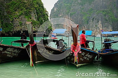Thai Man on a boat in Maya Bay Editorial Stock Photo