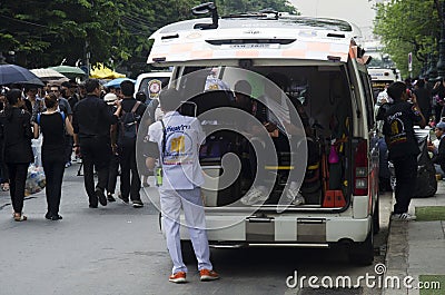 Thai officer operator staff of emergency ambulance vehicle stop waiting service patient people and travelers sick on street at Editorial Stock Photo