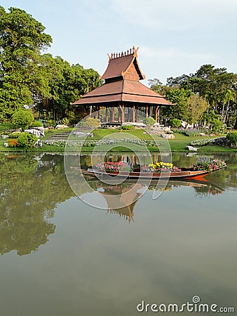 Thai pavilion and flower boat Stock Photo