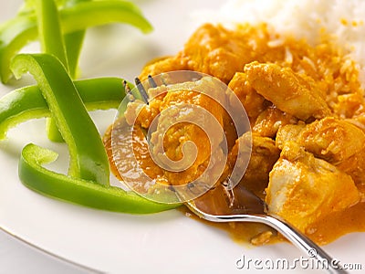 Thai peanut chicken curry with sliced green peppers Stock Photo