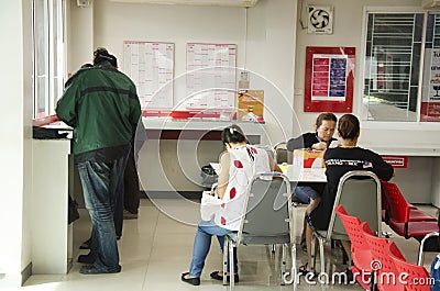 Thai people sending parcel post and employee service customer by Editorial Stock Photo