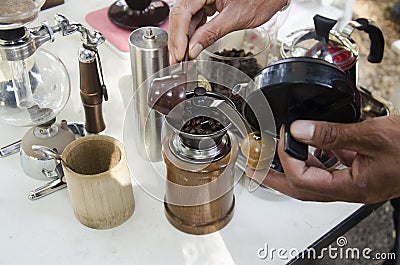 Thai people use antique manual coffee grinders made coffee for s Editorial Stock Photo