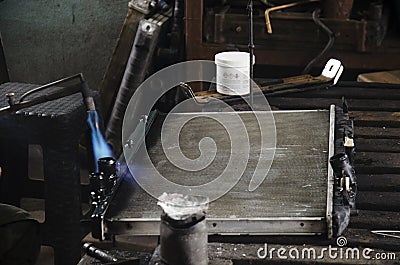 Thai people use lead and gas welding for fix and solder radiator Stock Photo