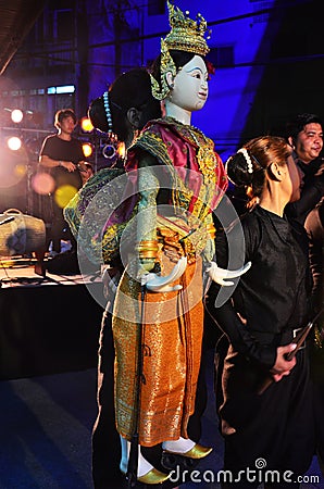 Thai professional puppeteer or Puppet master manipulate playing acting ancient puppets toy or antique marionette on stage for show Editorial Stock Photo