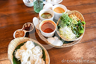 Thai rice vermicelli noodle with soup curry sauce and fresh vegetable set - Thai traditional menu Stock Photo