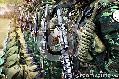 Thai soldiers stand in row.commando soldiers in camouflage uniforms gun in hand Stock Photo