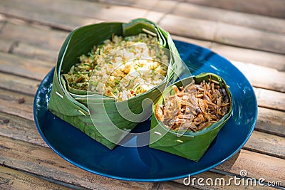 Thai Southern spicy rice salad with fried crispy anchovy Stock Photo