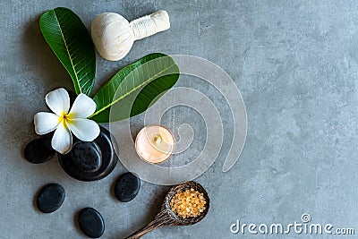 Thai Spa. Top view of white Plumeria flower setting for massage treatment and relax on black blackboard for text banner and copy s Stock Photo
