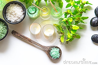 Thai Spa Treatments aroma therapy salt and nature green sugar scrub and rock massage with green orchid flower on wooden white wit Stock Photo