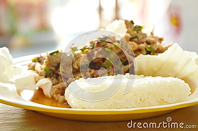 Thai spicy minced pork salad eat with sticky rice and fresh vegetable Stock Photo