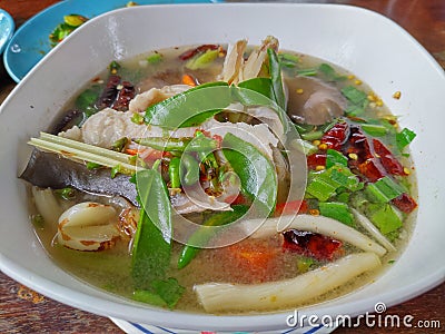 Thai Spicy seafood soup in a white bowl Stock Photo