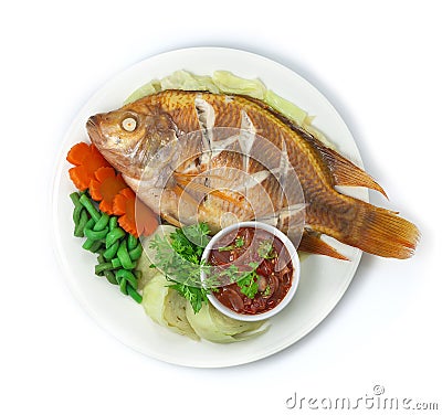 Thai Steamed Fish with Herb inside Red Tilapia Fish Stock Photo