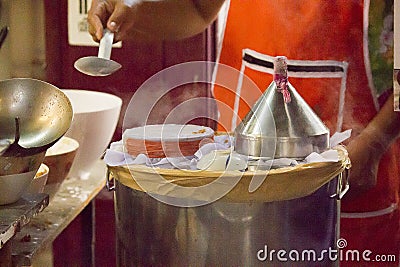 Thai steamed rice-skin dumplings by stretching the fabric on the pot mouth Stock Photo