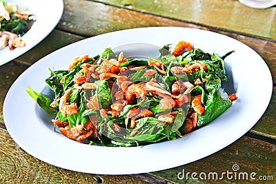 Thai stir fried green vegetables with dried shrimps Stock Photo