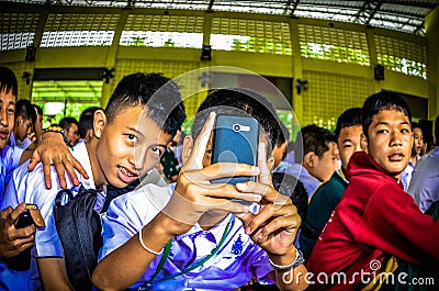 Thai Student Use Mobile Phone Take a photo. Editorial Stock Photo