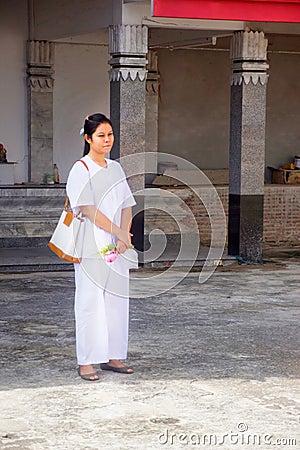 Thai students wear white clothes making a merit at the temple in Pranburi, Thailand July 21,2017 Editorial Stock Photo