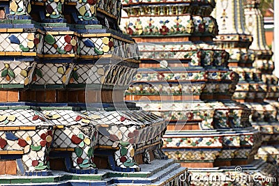 Thai Stupas with Mosaic Tiling Detail, Left Foreground Focus Stock Photo