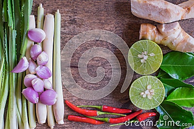 Thai Tom Yam soup herbs and spices on vintage wood background. Herb Ingredients. Center Space. Stock Photo