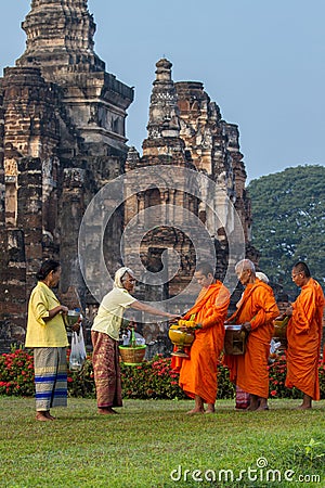 Thai traditional merit give food to monk Editorial Stock Photo