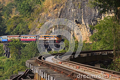 Thai trains running on death railways crossing kwai river in kan Stock Photo