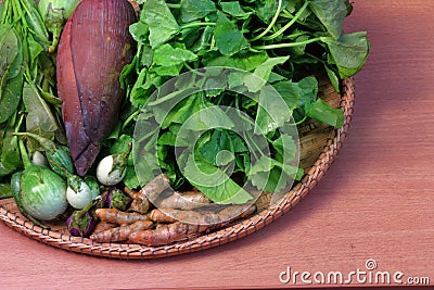 Thai vegetable, food ingredients and herbs in rattan basket Stock Photo