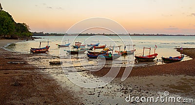 Thai village fishing boats park on the beach Stock Photo