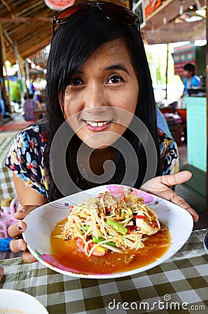 Thai woman portrait with Green papaya salad or somtum Stock Photo