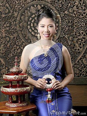 Thai woman in silk dress Stock Photo