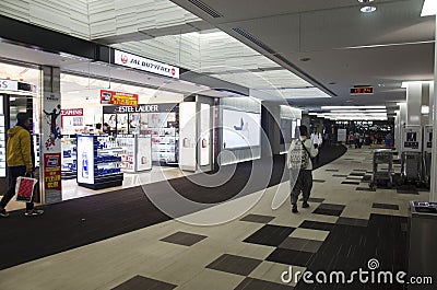 Thai woman walking to gate inside at Narita International Airport Editorial Stock Photo